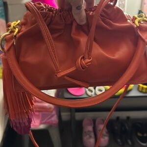 Yuzefi Orange Drawstring Crossbody Bag with Tassel
